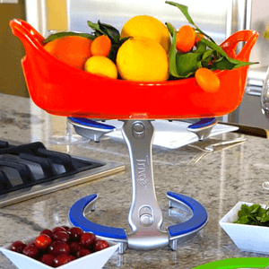Blue display stand with orange bowl with fruit